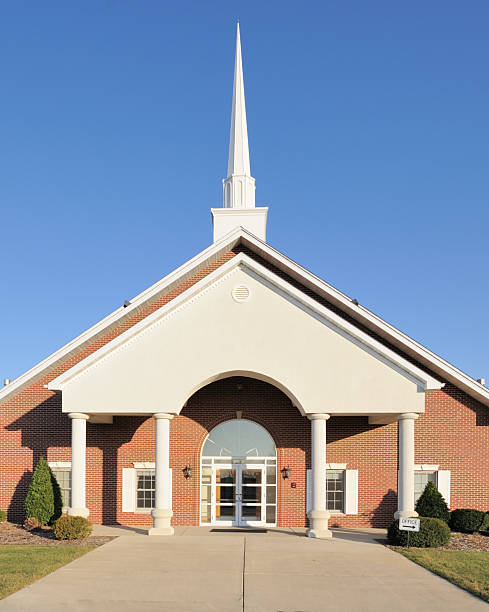 Christian church with steeple against blue sky christian church with steeple against blue sky